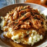 crockpot shredded chicken gravy over mashed potatoes