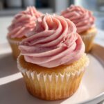 lemon cupcakes with raspberry buttercream frosting