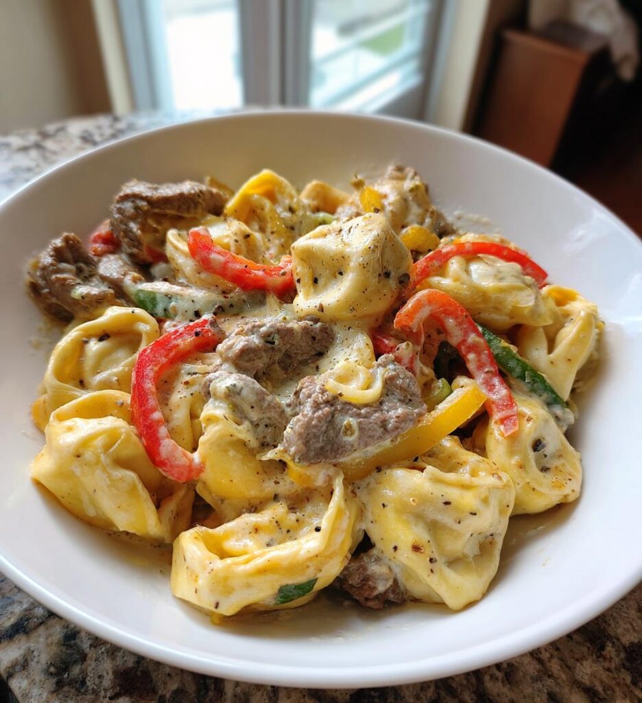 one pot cheesesteak tortellini with provolone sauce